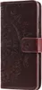 A close-up view of a brown flip phone case with a mandala pattern embossed on it. Produktbild-Vorschau