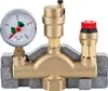A brass heating system safety group with a pressure gauge and relief valve, mounted on a gray insulating base. Anteprima dell’immagine prodotto