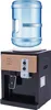 A freestanding water dispenser with a water bottle on top. Náhled obrázku produktu