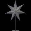 A gray star-shaped decoration on a stand against a black background. Podgląd zdjęcia produktu