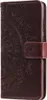 A brown flip case cover for a Samsung Galaxy A22 4G phone with a mandala pattern embossed on it. Produktbild-Vorschau