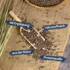 A close-up shot of lentils on a burlap sack, with informational text overlays. Produktbild-Vorschau