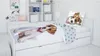 A child's bed with bedding featuring a dog print. Podgląd zdjęcia produktu