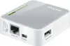 A close-up, angled view of a white and gray TP-Link wireless router. Produktbild-Vorschau