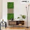 A modern living room setting with a vertical green wall panel and a wooden media console. Produktbild-Vorschau