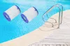 Two pool filter cartridges are shown floating in a swimming pool next to a pool ladder. Produktbild-Vorschau