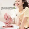 A young woman smiling is shown next to a pink clip-on fan. Produktbild-Vorschau