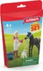 A box for a Schleich toy set featuring a girl, a foal, and a dog in a grassy field. Anteprima dell’immagine prodotto