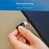 A hand is inserting a USB-C audio adapter into a laptop. Produktbild-Vorschau