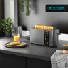 A modern kitchen counter with a toaster, toast, and orange juice. Voir les images du produit