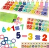 A collection of Montessori-style educational toys for children, including number and shape sorting boards, counting rings, and math equation blocks. Produktbild-Vorschau