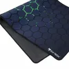 A close-up view of a gaming mousepad with a hexagonal pattern. Náhled obrázku produktu