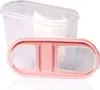 A transparent plastic food storage container with a pink lid, shown from a slightly elevated angle. Anteprima dell’immagine prodotto