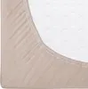 A close-up view of a beige fitted sheet on a white mattress. Náhled obrázku produktu