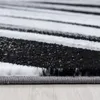 A close-up, angled view of a carpet with black, white, and gray stripes. Anteprima dell’immagine prodotto