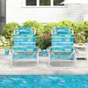 Two beach chairs are set up on a patio next to a swimming pool. Produktbild-Vorschau