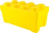 A bright yellow LEGO storage box shaped like a large LEGO brick, shown against a white background. Podgląd zdjęcia produktu
