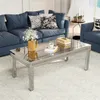 A living room scene with a blue sofa and a mirrored coffee table. Anteprima dell’immagine prodotto
