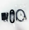 A collection of accessories for a computer monitor, including a power adapter and cables, laid out on a white background. Produktbild-Vorschau
