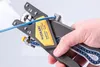 A hand is holding a wire stripping tool, with a blue wire inserted into it. Anteprima dell’immagine prodotto