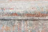 A close-up view of a folded rug with a textured pattern. Anteprima dell’immagine prodotto