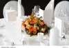 A table setting for an event with a floral centerpiece, menus, and place settings. Produktbild-Vorschau