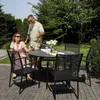 A couple enjoys drinks in a garden setting with a dining set. Produktbild-Vorschau