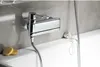 A close-up shot of a chrome bathtub faucet mounted on a tiled wall above a white bathtub. Náhľad obrázku produktu