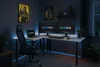 A modern gaming desk setup in a dimly lit room. Anteprima dell’immagine prodotto