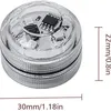 A close-up shot of a small, clear, cylindrical LED light with visible electronic components inside, next to measurement indicators. Produktbild-Vorschau