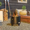 An outdoor patio scene with a fire pit, firewood, and seating. Produktbild-Vorschau