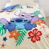 A close-up view of a Stitch-themed duvet cover with Stitch and Angel characters, along with tropical flowers and leaves. The bedding is laid out on a bed. Produktbild-Vorschau