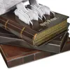 A close-up view of a 4D-Build Harry Potter model, resembling a stack of books, with some of the model's components visible. Produktbild-Vorschau