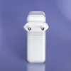 A white Apple MacBook charger is shown against a light purple background. Produktbild-Vorschau