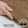 A hand touching a textured rug, with a close-up inset showing the thickness. Produktbild-Vorschau