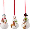 Three ceramic snowman ornaments hanging from red ribbons against a white background. Podgląd zdjęcia produktu