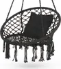 A black macrame hanging chair with a black cushion, suspended against a white background. Voir les images du produit
