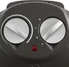 A close-up view of the control panel of a heater, showing two silver knobs, a red indicator light, and some markings. Podgląd zdjęcia produktu