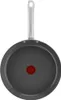 The image shows the underside of a frying pan with a handle. Podgląd zdjęcia produktu