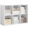 A white cube storage unit filled with various items like books, boxes, and a magazine holder. Voir les images du produit