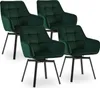 Four green velvet dining chairs are arranged in a studio setting against a white background. Voir les images du produit