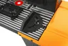 A close-up view of a router table with a miter gauge and a red insert. Podgląd zdjęcia produktu