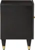 A side view of a black nightstand with gold accents on its legs. Náhled obrázku produktu