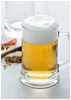 A close-up shot of a beer mug filled with beer and foam, with a slice of bread and some ham in the background. Náhľad obrázku produktu