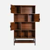 A wooden bookshelf with multiple compartments and some doors open, against a white background. Produktbild-Vorschau