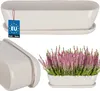 A collage of images showing a white ceramic planter with a saucer, a close-up of the planter, and the planter filled with pink heather. Produktbild-Vorschau