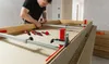 A man is assembling a door frame using specialized clamps. Anteprima dell’immagine prodotto