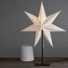 A white star-shaped lamp and a white lampshade on a wooden surface against a gray background. Podgląd zdjęcia produktu