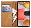 A book-style phone case with cards and cash inserted, displayed against a background of decorative spheres. Anteprima dell’immagine prodotto