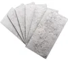Stack of five rectangular gray filter pads fanned out on a white background Produktbild-Vorschau